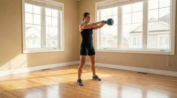 Woman training with a kettlebell at home, demonstrating dynamic strength through controlled movement