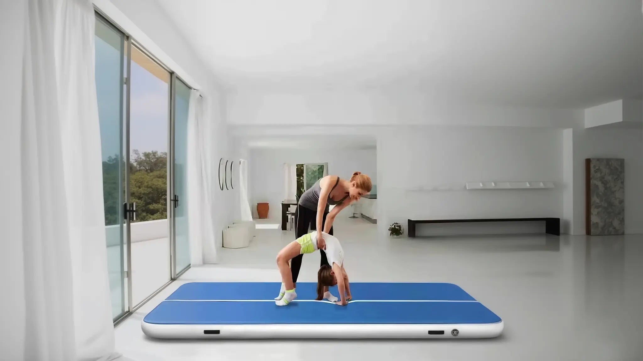 Parent helping child practice backbend on inflatable air track mat in modern living room for safe indoor active play