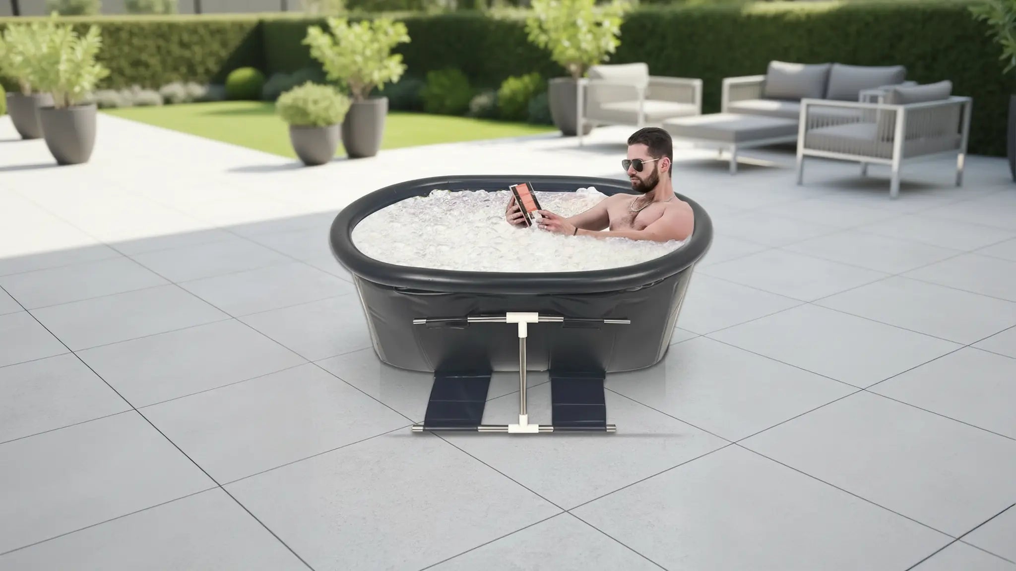 Man relaxing in portable ice bath tub filled with ice on outdoor patio