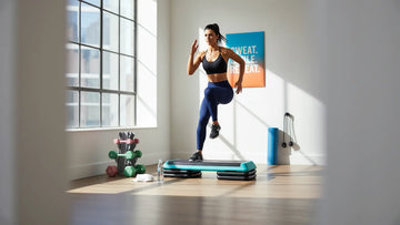 Woman doing high-intensity step platform cardio workout in a bright home gym.