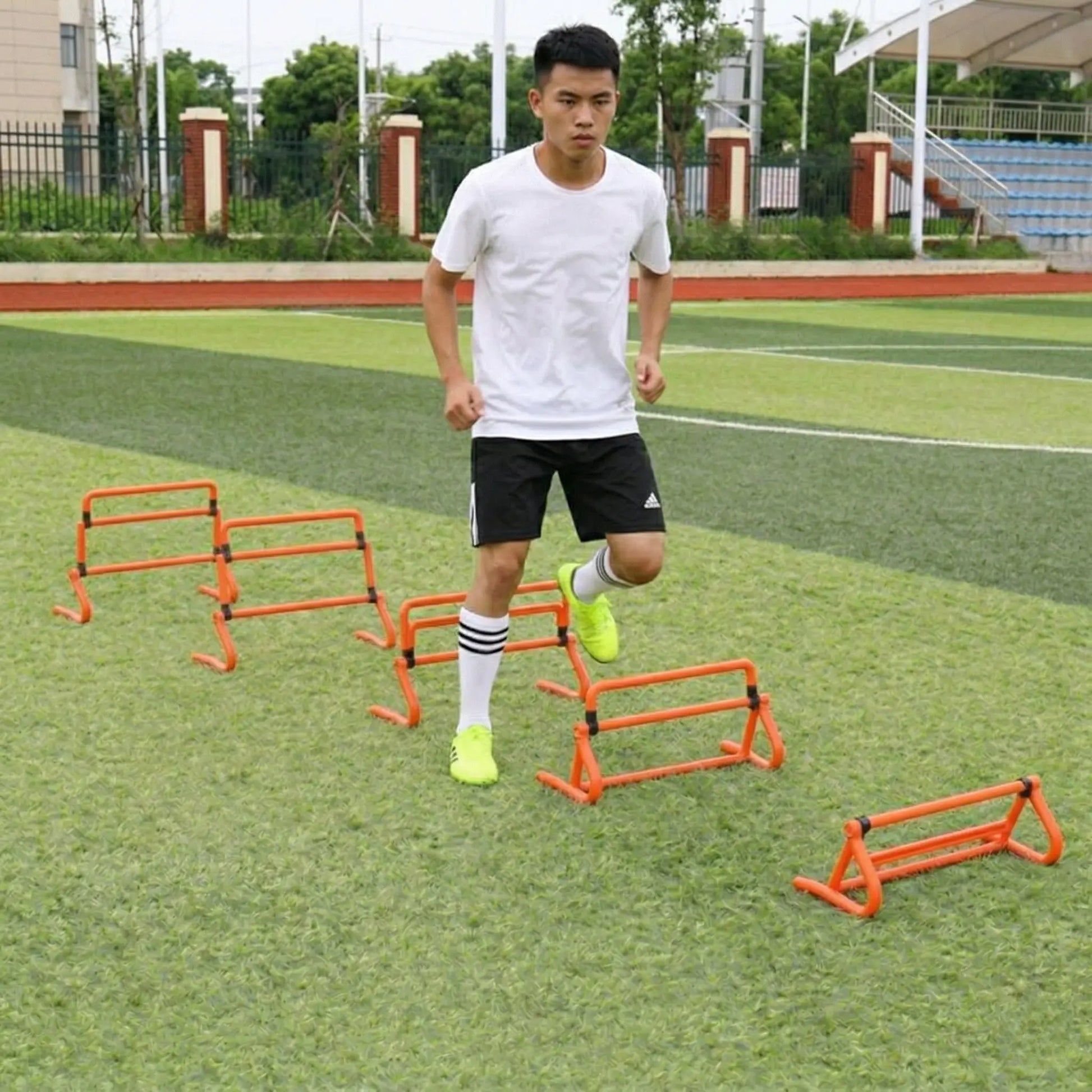 Athlete using adjustable agility hurdles for speed and coordination drills
