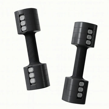 Pair of adjustable dumbbells with removable weight plates, shown in black