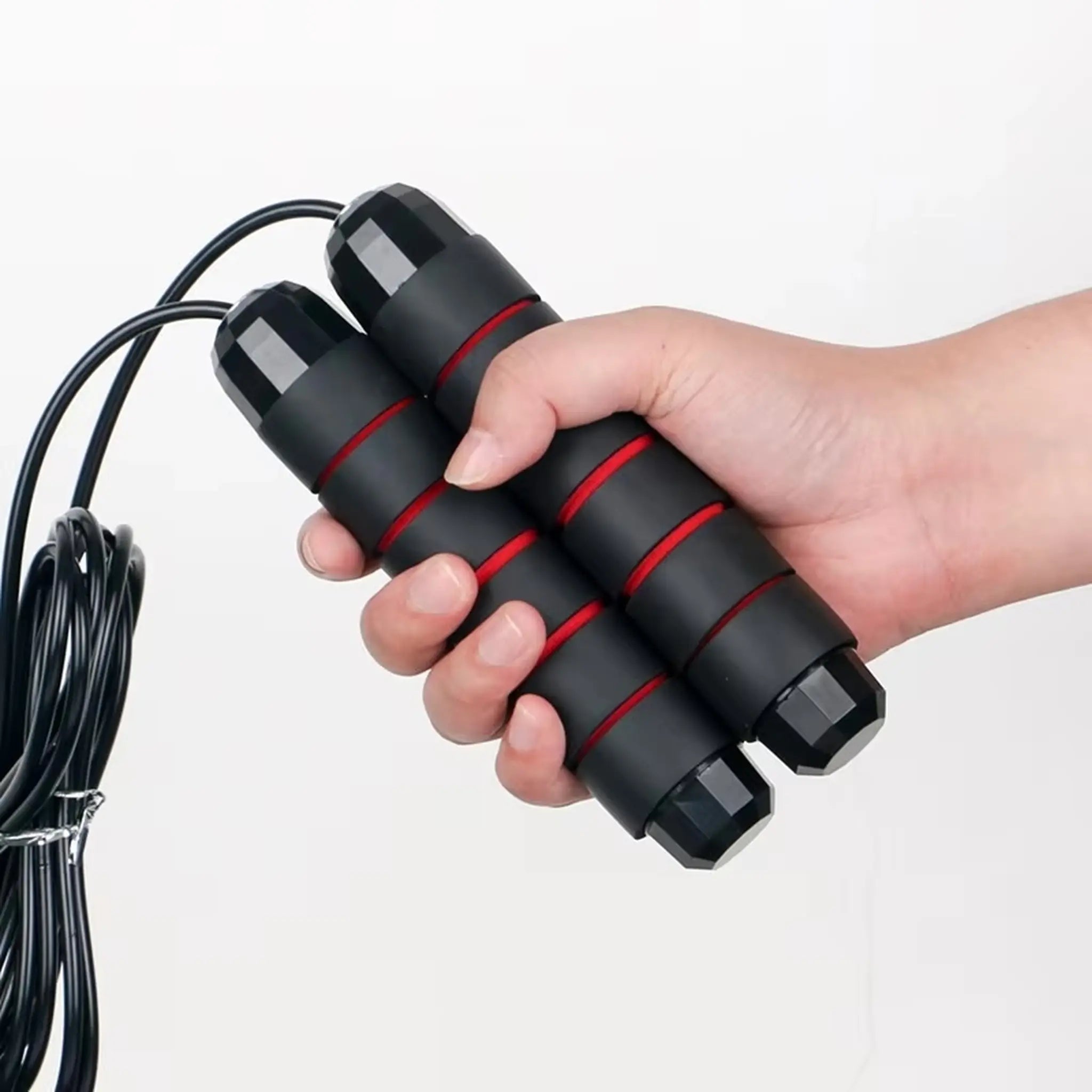 Skipping rope handles held together showing ergonomic foam grip design