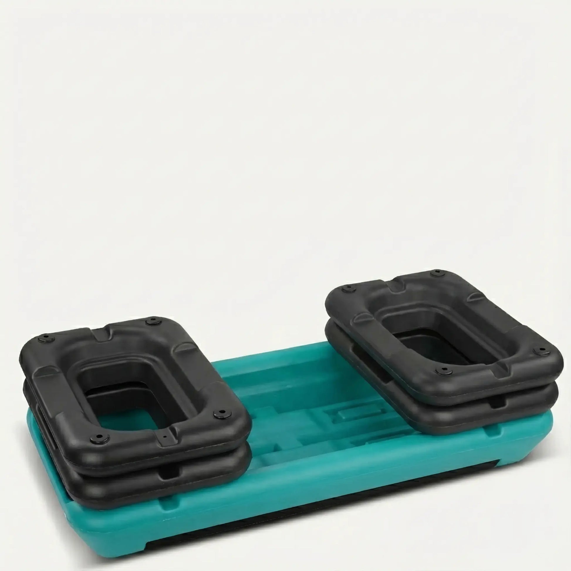 Upside down turquoise and black aerobic step a white background