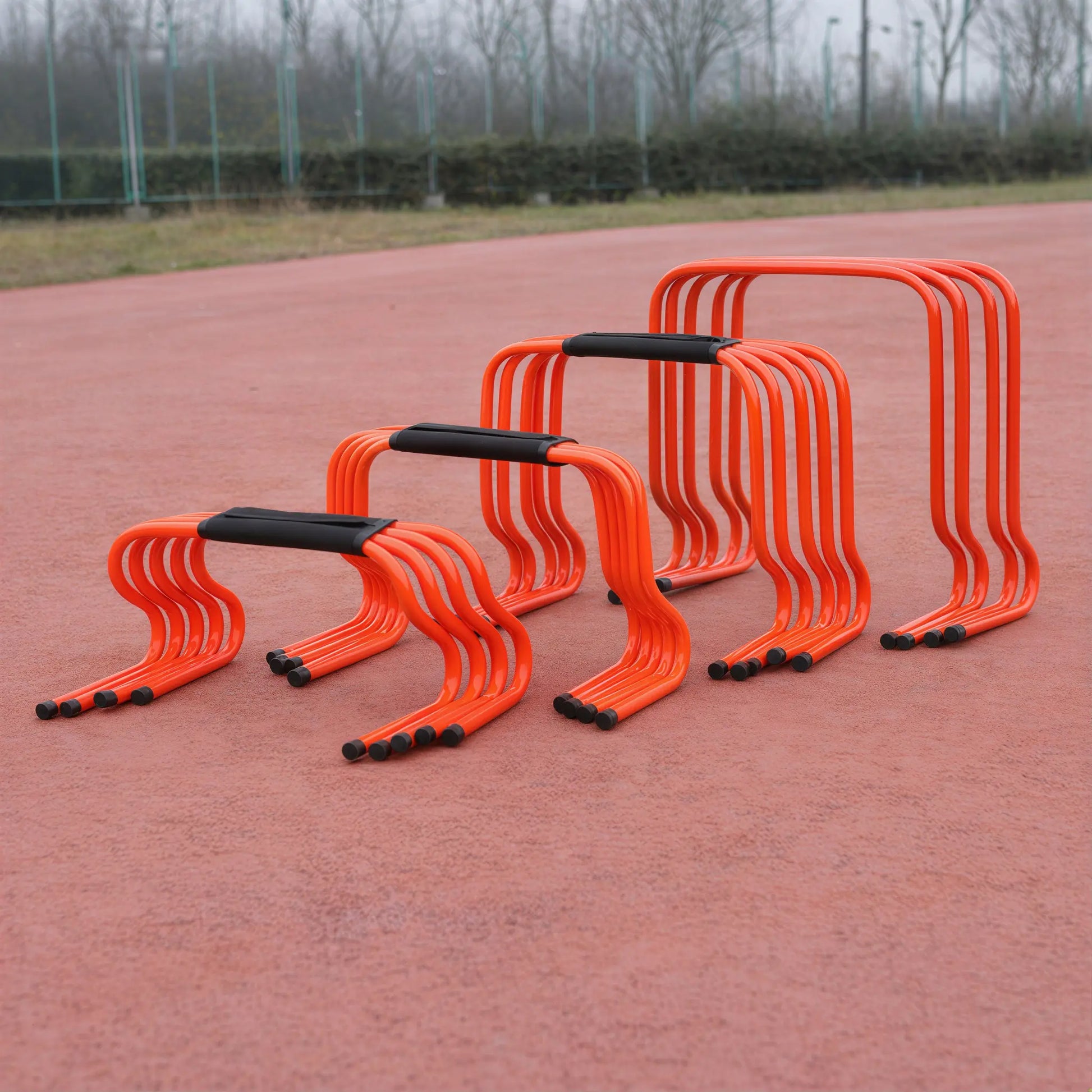 Agility hurdles in multiple fixed heights arranged from low to high