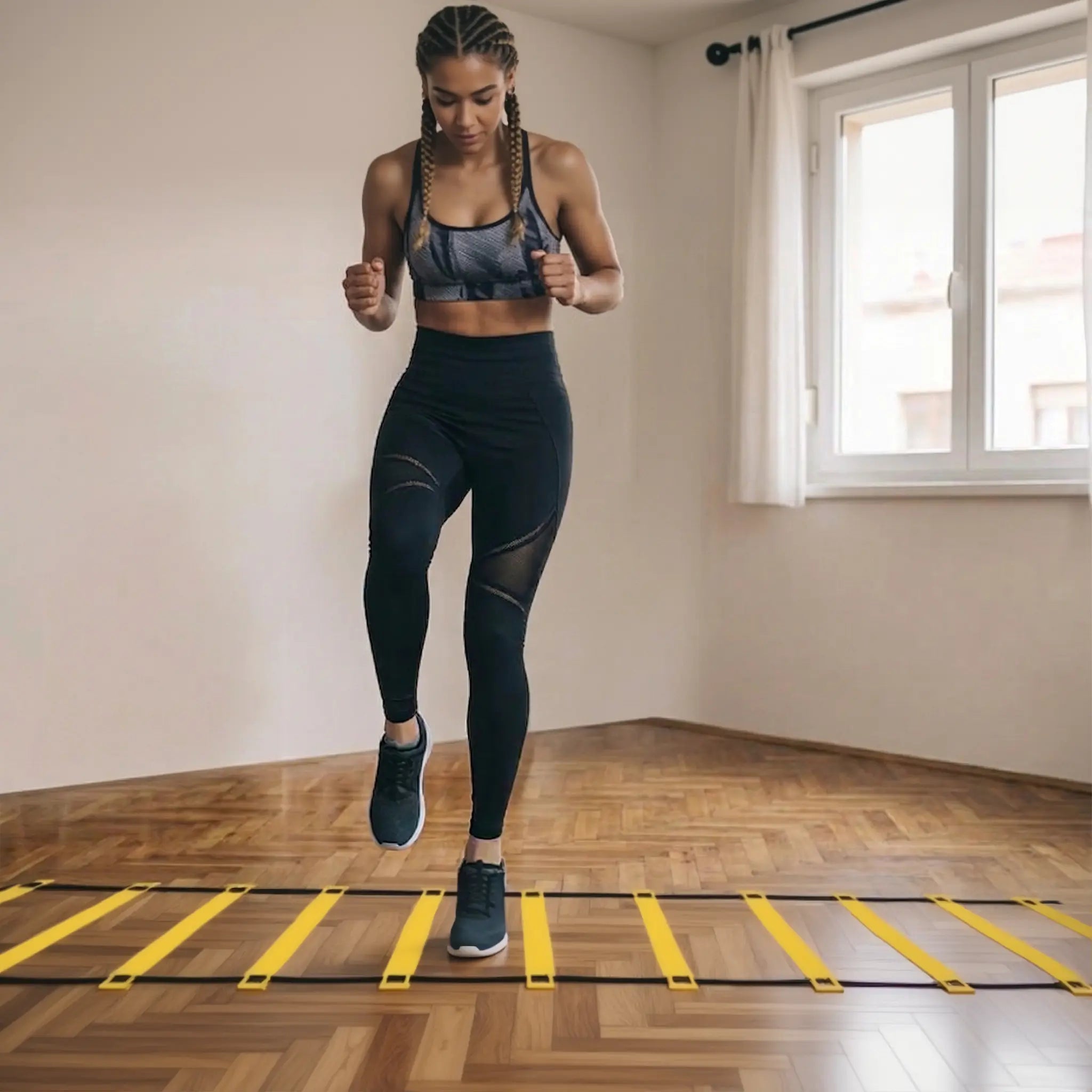 Woman doing high-knee footwork drill on agility ladder indoors