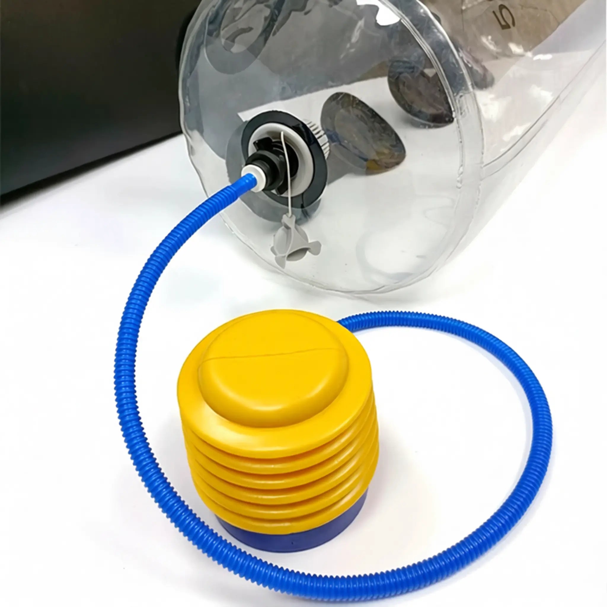 Included pump connected to aqua training bag for inflating after filling with water