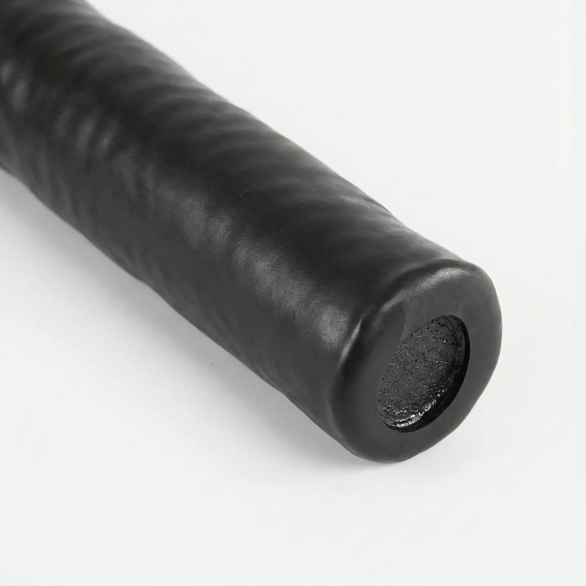 Close-up of battle rope handle showing grip and protective finish