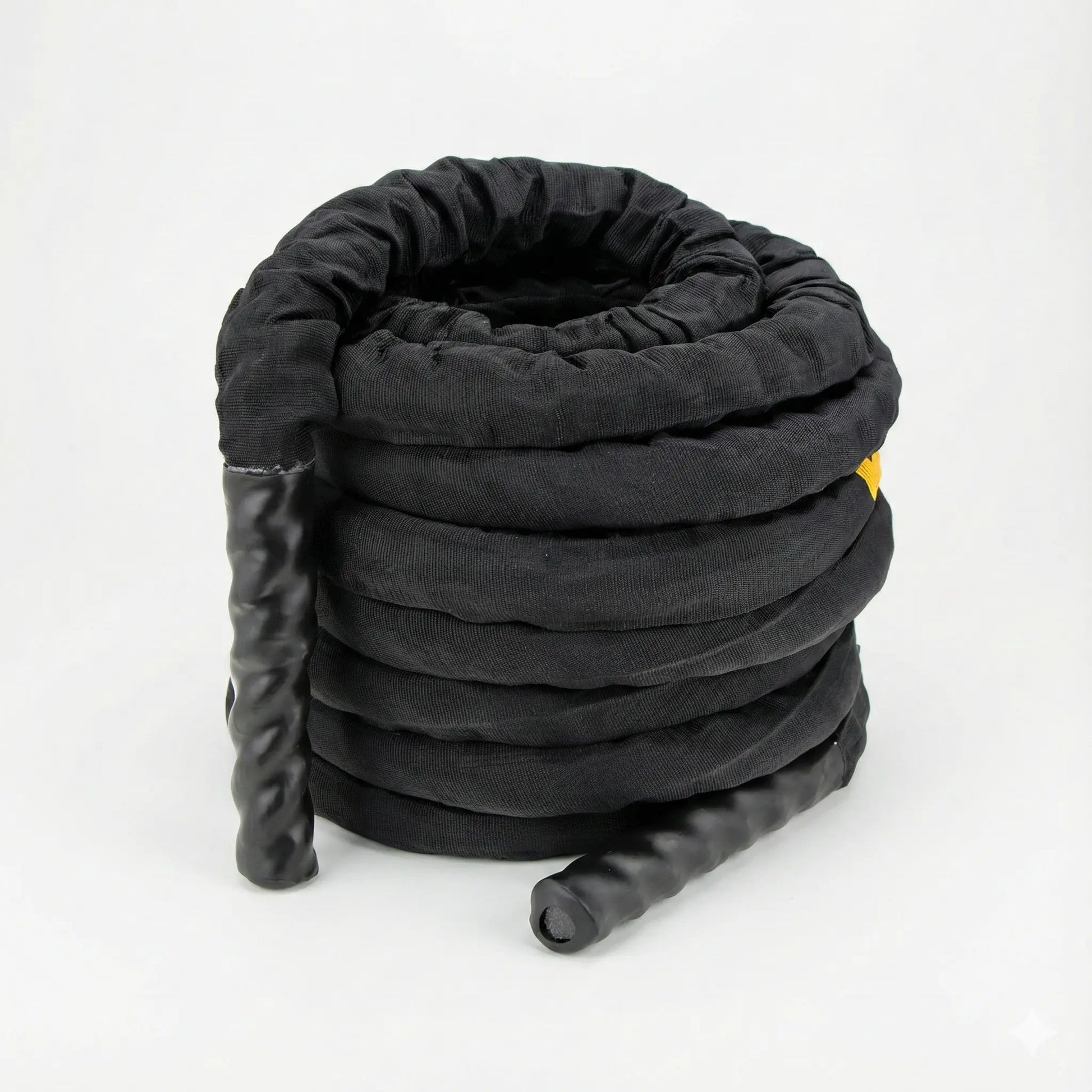 Battle rope with protective sleeve coiled on a white background
