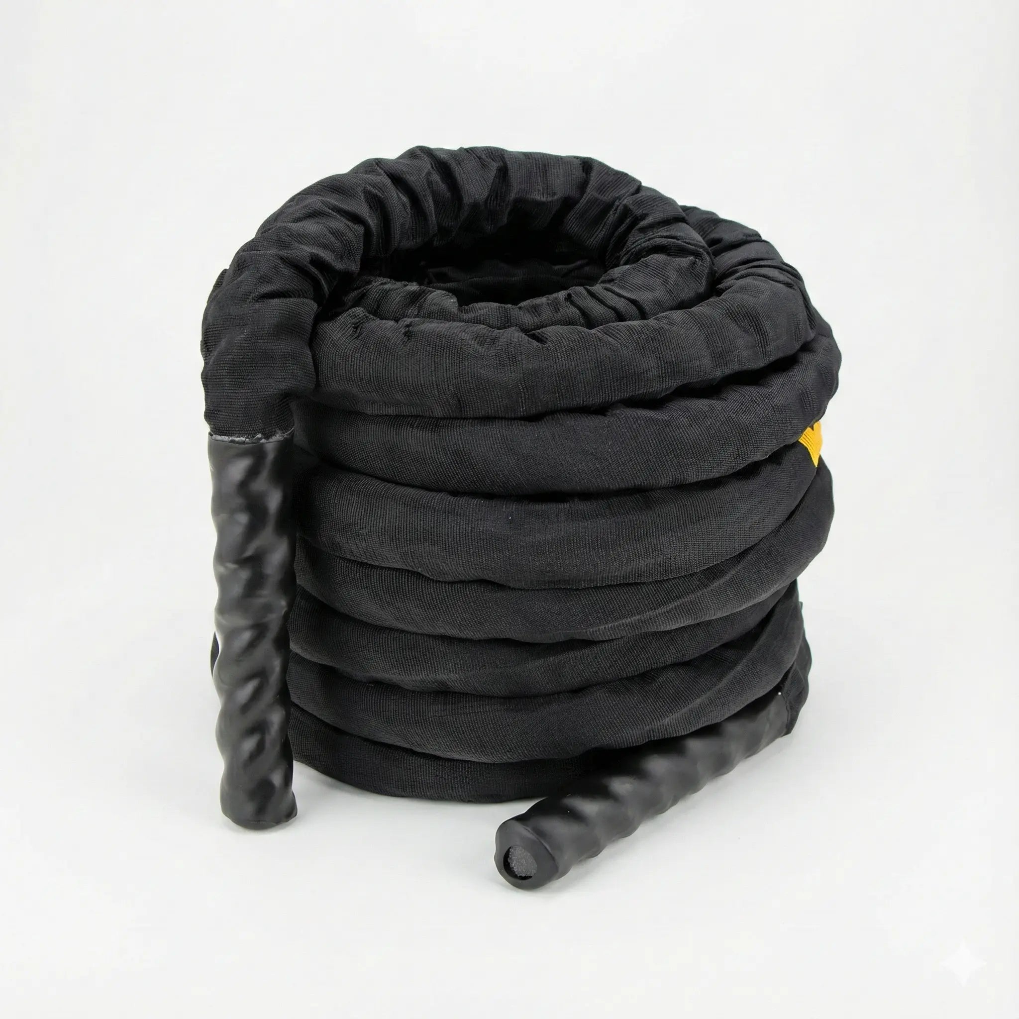 Battle rope with protective sleeve coiled on a white background
