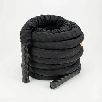 Battle rope with protective sleeve coiled on a white background