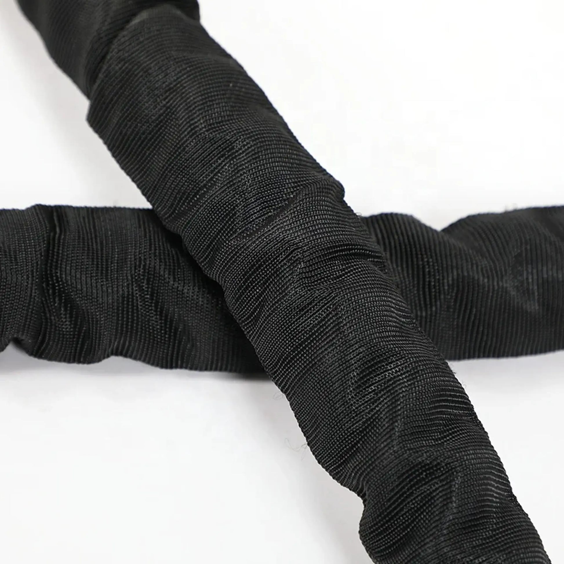 Detail of the protective sleeve on a battle rope showing durable outer material