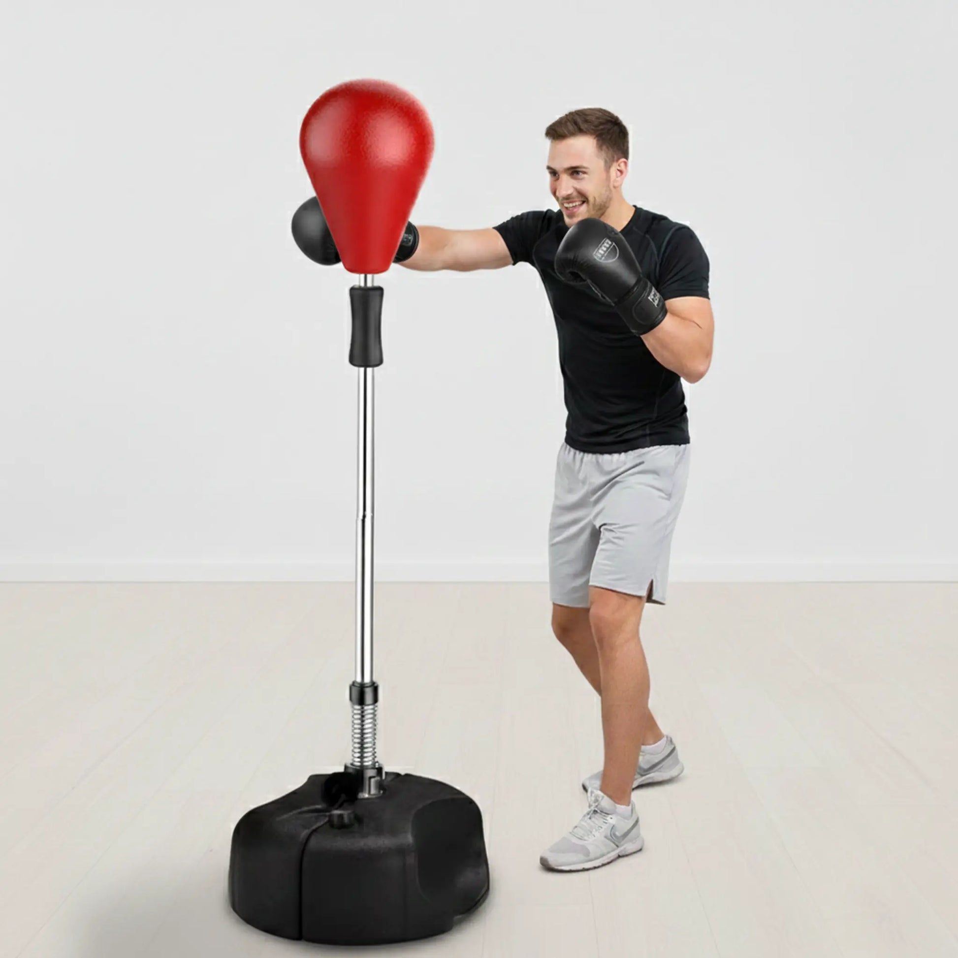 Man using freestanding boxing speed ball for reaction, coordination, and cardio training