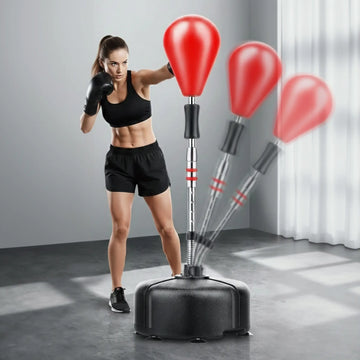 Woman training with freestanding boxing speed ball showing rebound motion for reaction and cardio workouts