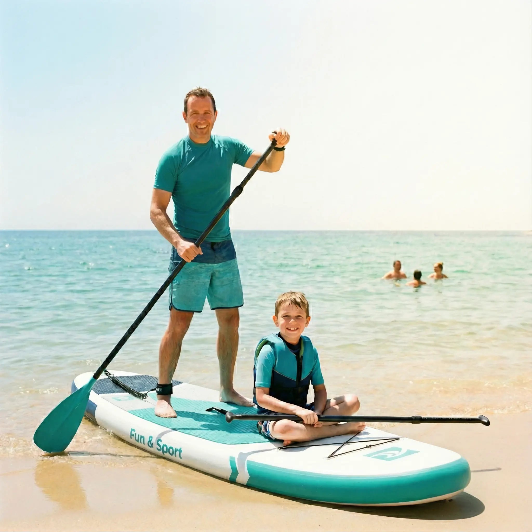 Father and child on a Fun & Sport paddleboard at the beach enjoying outdoor adventure.