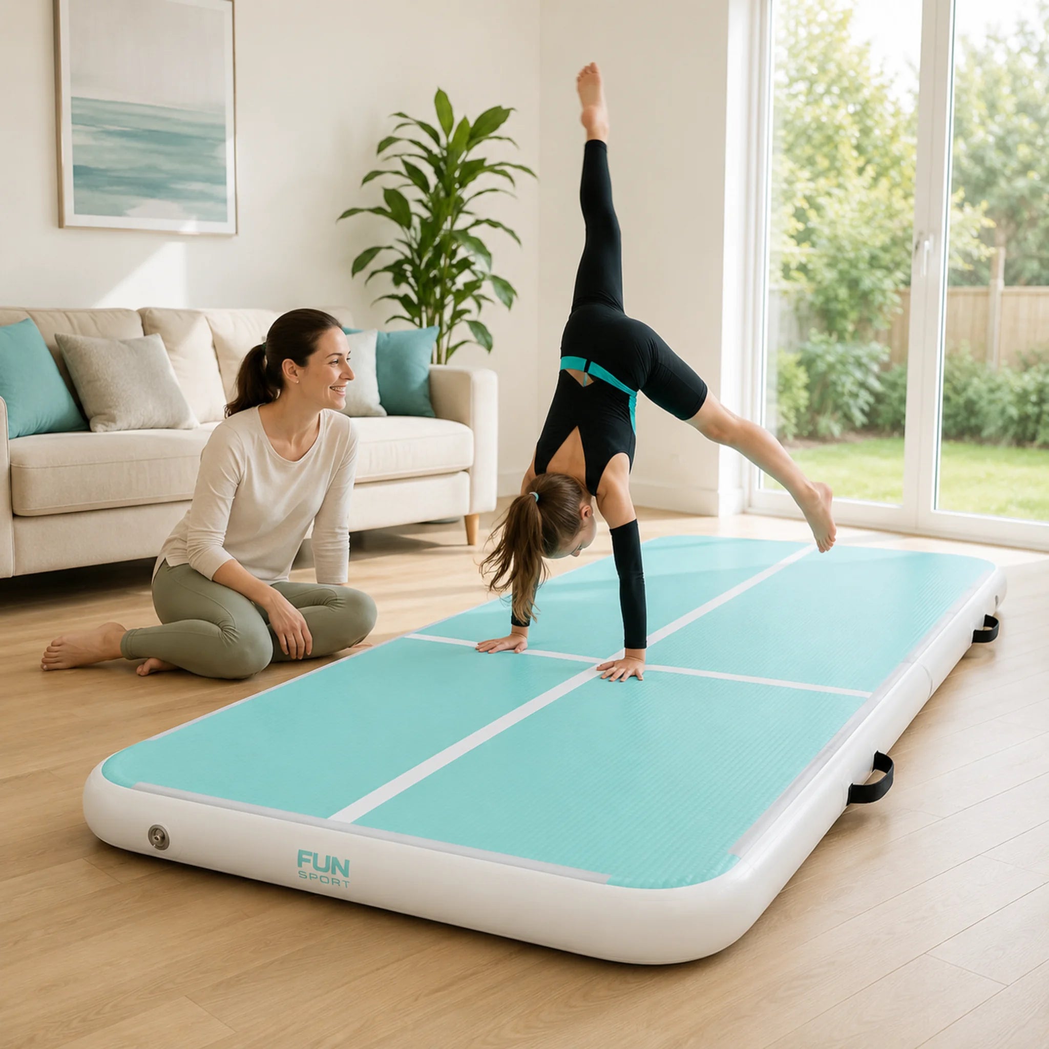 Child practising gymnastics on an inflatable air track at home