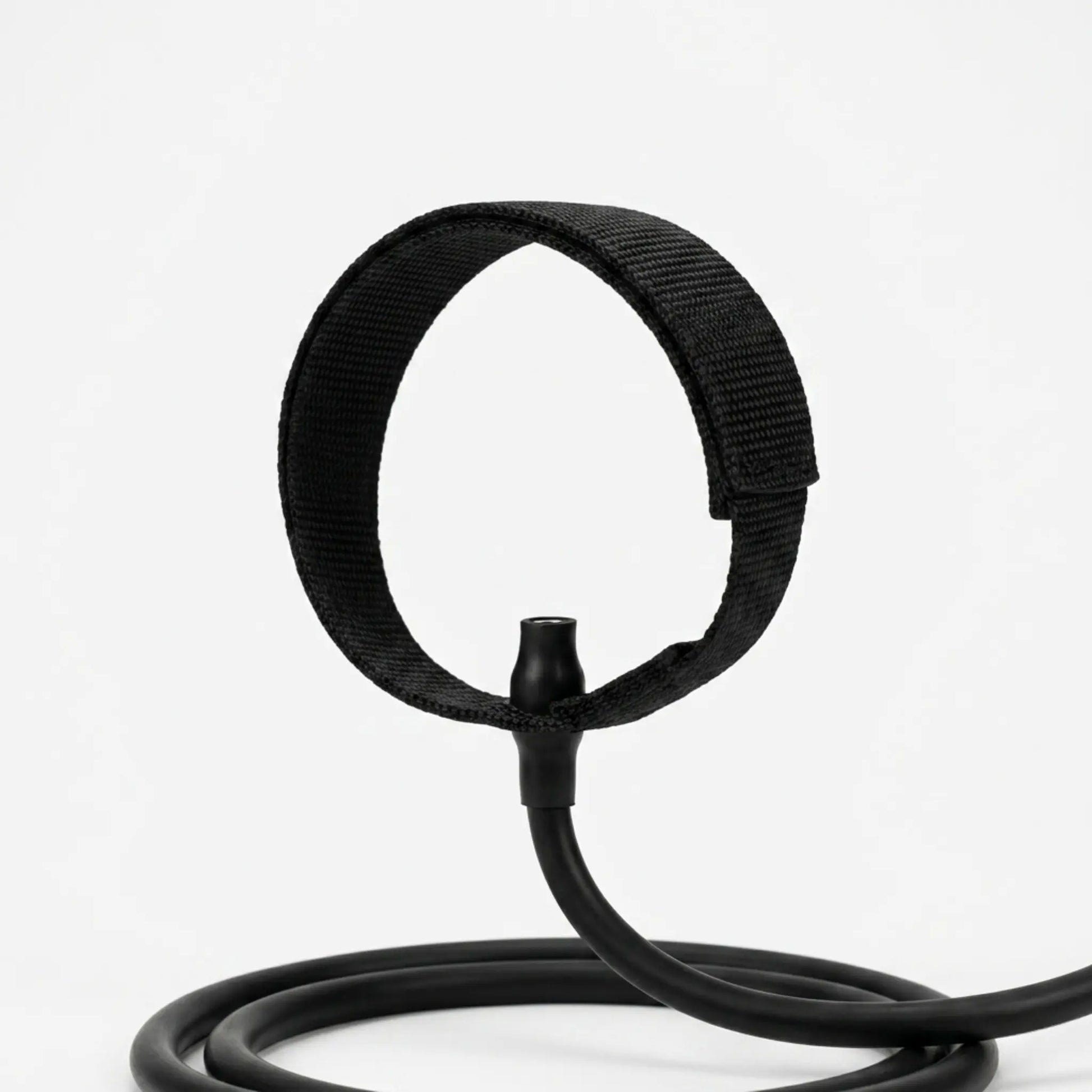 Close-up of ankle strap attachment connected to a Pilates bar resistance band system