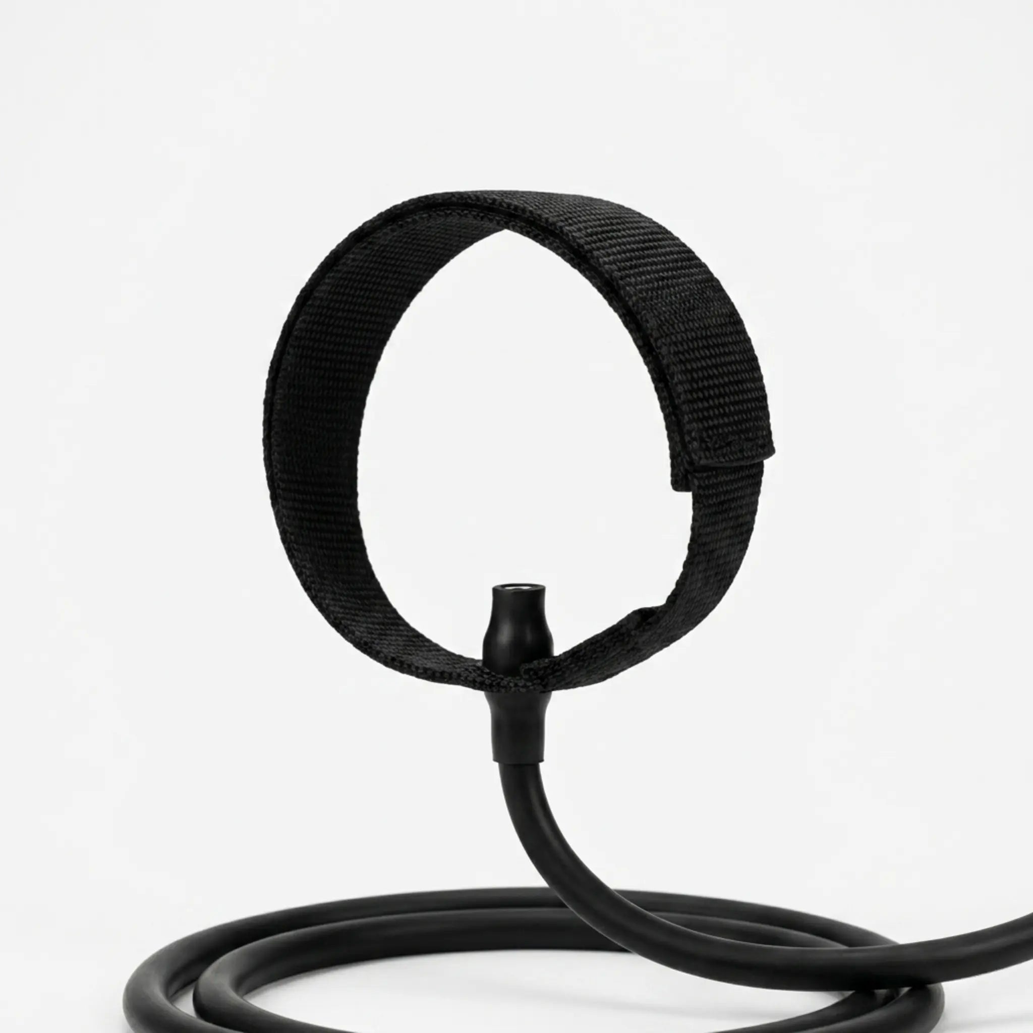 Close-up of ankle strap attachment connected to a Pilates bar resistance band system