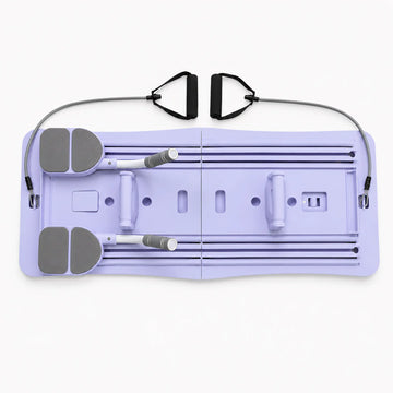 Foldable Pilates board with resistance bands and spring-assisted sliding rails on white background
