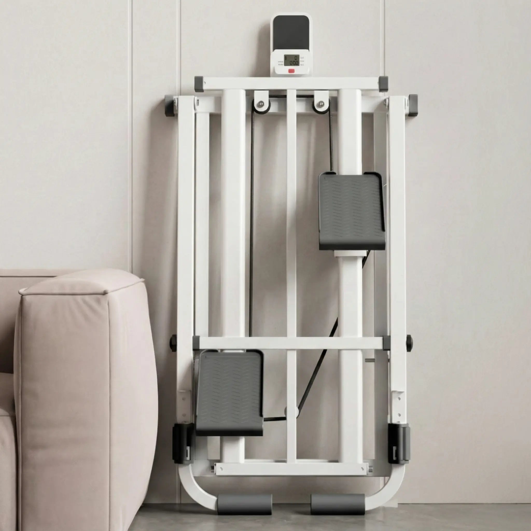 Stepper machine folded upright beside a sofa, showing compact storage.