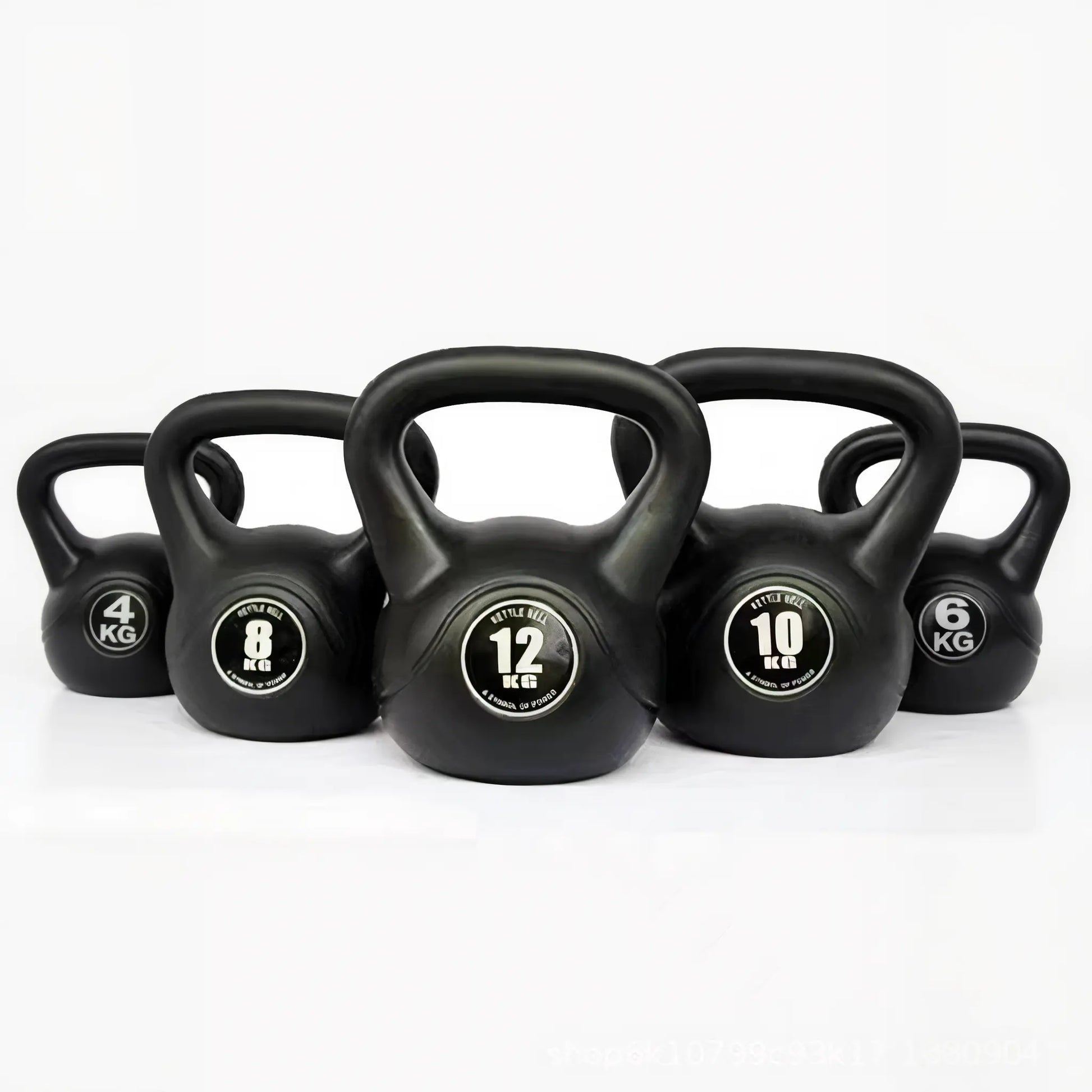 Set of black vinyl-coated kettlebells with weight markings on a white background