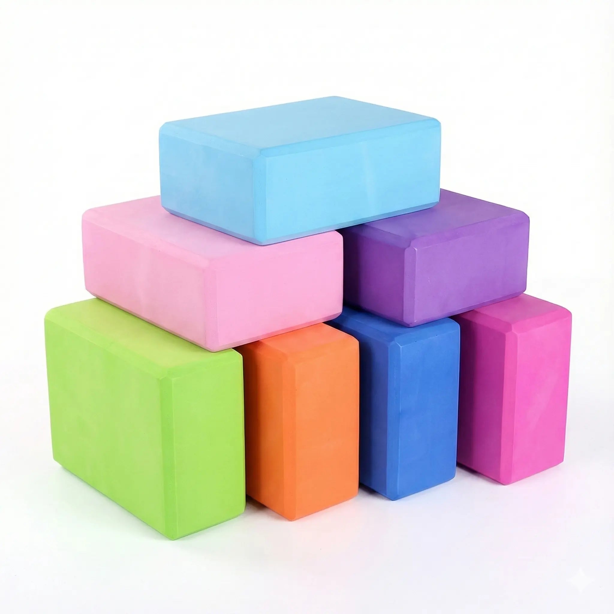 Stack of colourful EVA foam yoga blocks.